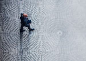 Man Walking on Tiled Floor